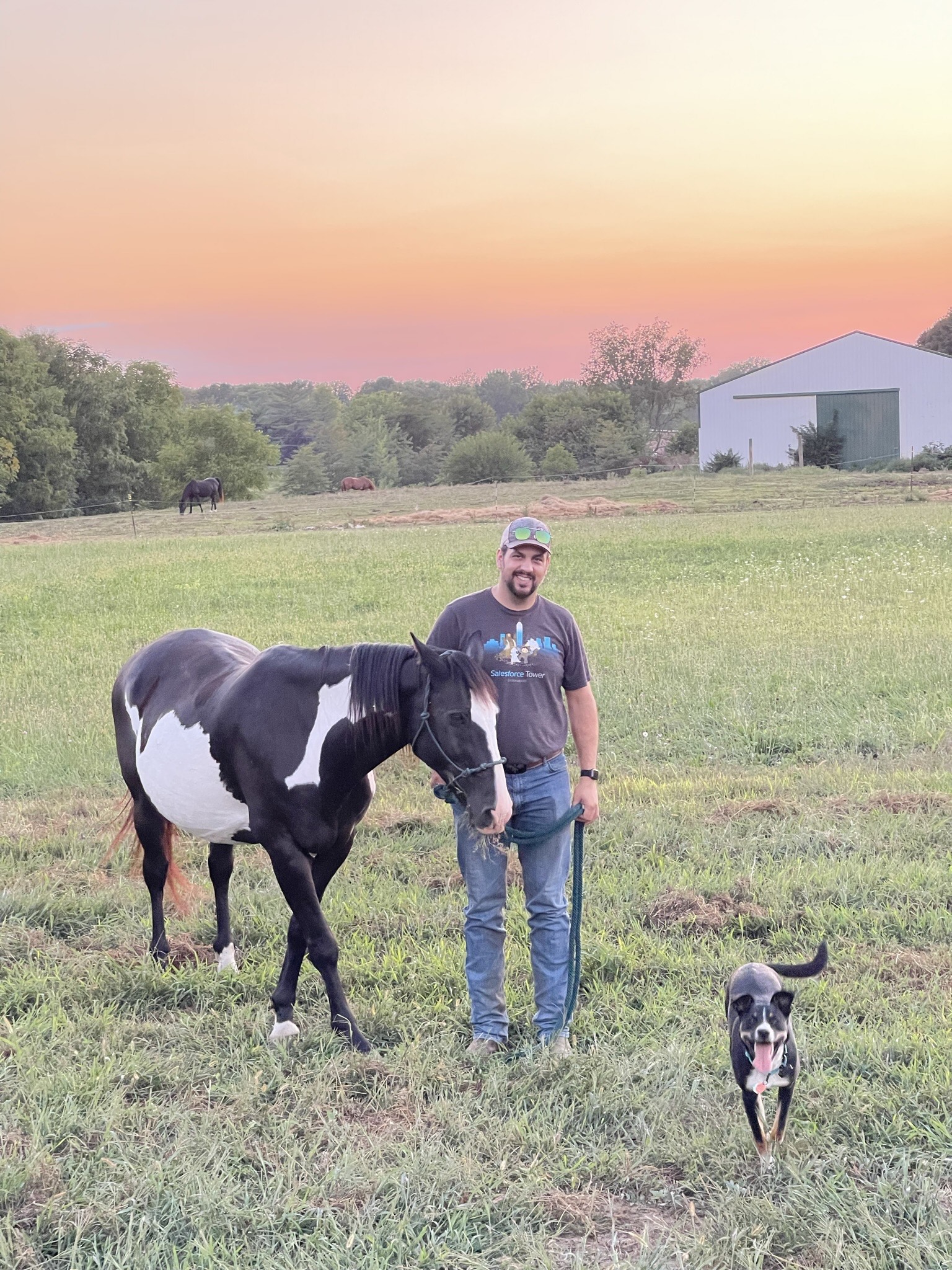 Travis Ferguson with his horse, Pip, and his dog, Oakley.