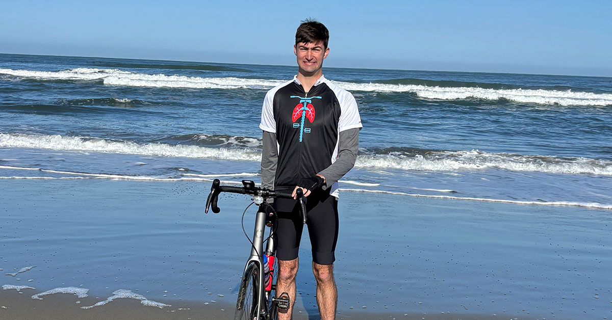 Jack Owens by the Pacific Ocean in San Francisco, Calif., where he started his cross-country bike ride