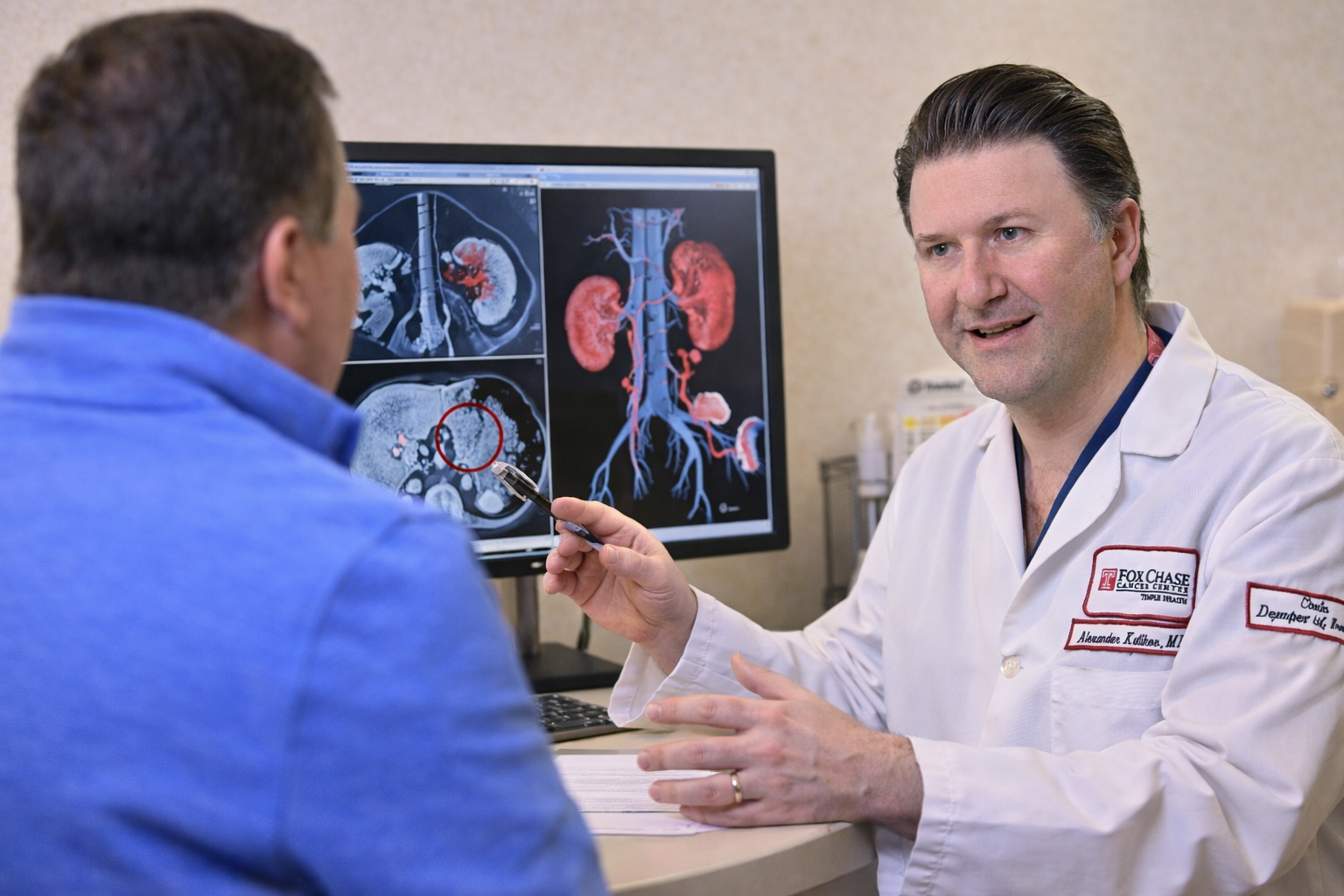 Dr. Kutikov with a patient