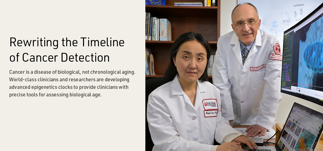 Drs Lee and Gerhard at computer with their research