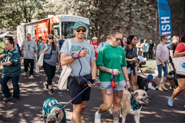 People and dogs walking at the Paws for the Cause Event