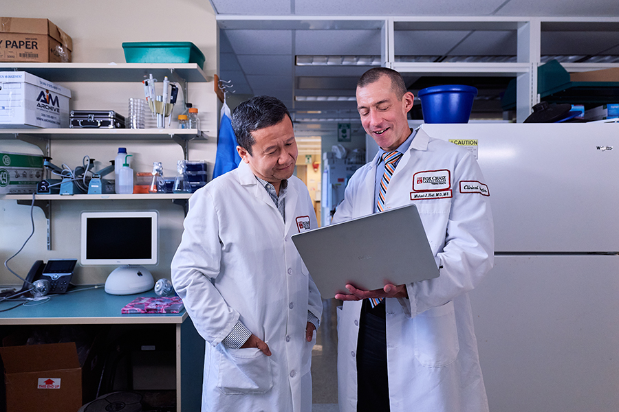 Yu “Sunny” Liu, PhD, Director of Bioinformatics at the Biostatistics and Bioinformatics Facility and Michael J. Hall, MD, MS, FASCO, Chair of the Department of Clinical Genetics