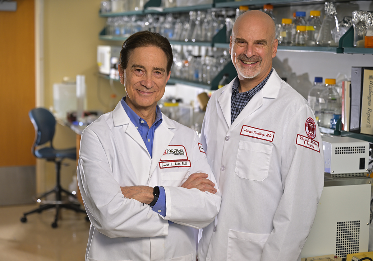 "Dr. Testa and Dr. Friedberg standing in a laboratory"