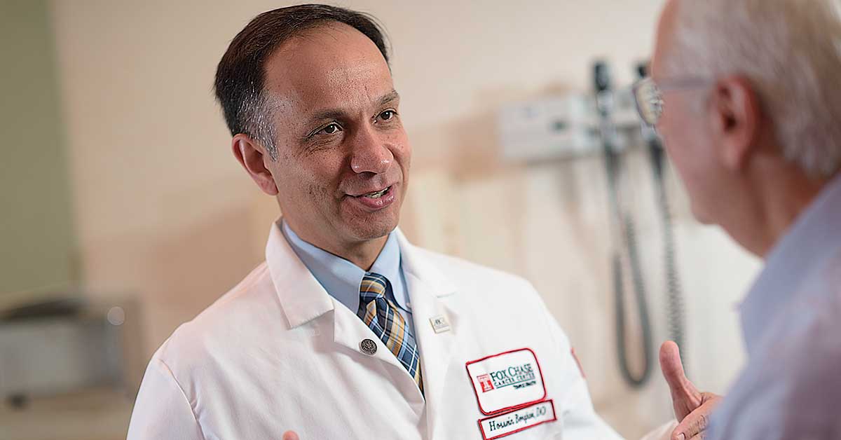 Hossein Borghaei, DO, MS, chief of Thoracic Medical Oncology, working with a patient.