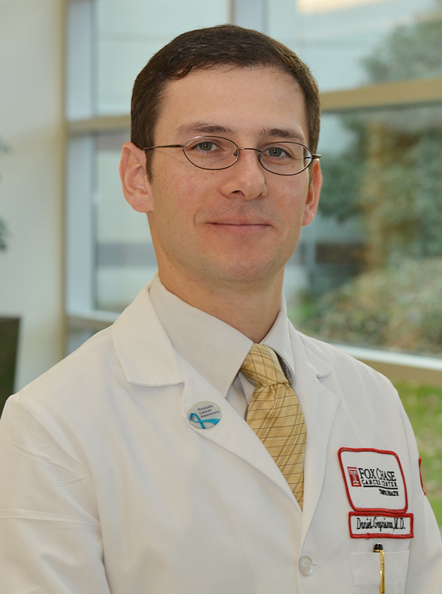 A portrait shot of Dr. Daniel M. Geynisman, MD, smiling at the camera.