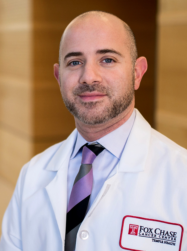 A portrait shot of Dr. Elias Obeid, MD, MPH, smiling at the camera.