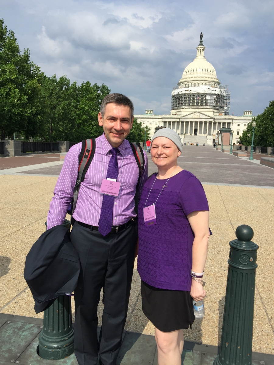 A photograph of Igor Astsaturov, MD, PhD, and patient Melissa Kartasevich, standing outside the White House.
