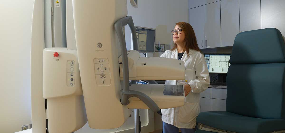 Nga Nguyen, a technician in the department of nuclear medicine, uses molecular breast imaging as a screening tool to detect signs of breast cancer.