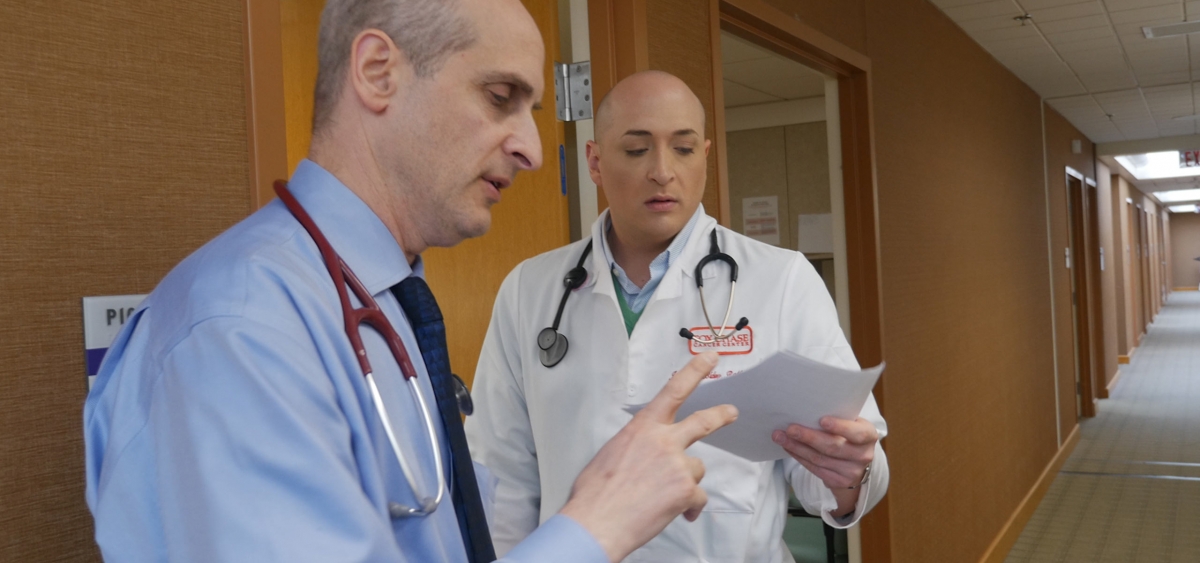 Alan Haber, the director of pulmonary service, reviews a pleural disease case with Registered Nurse Jonathan Bidey.