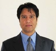 A portrait shot of Roshan Thapa, MD, with a white background.