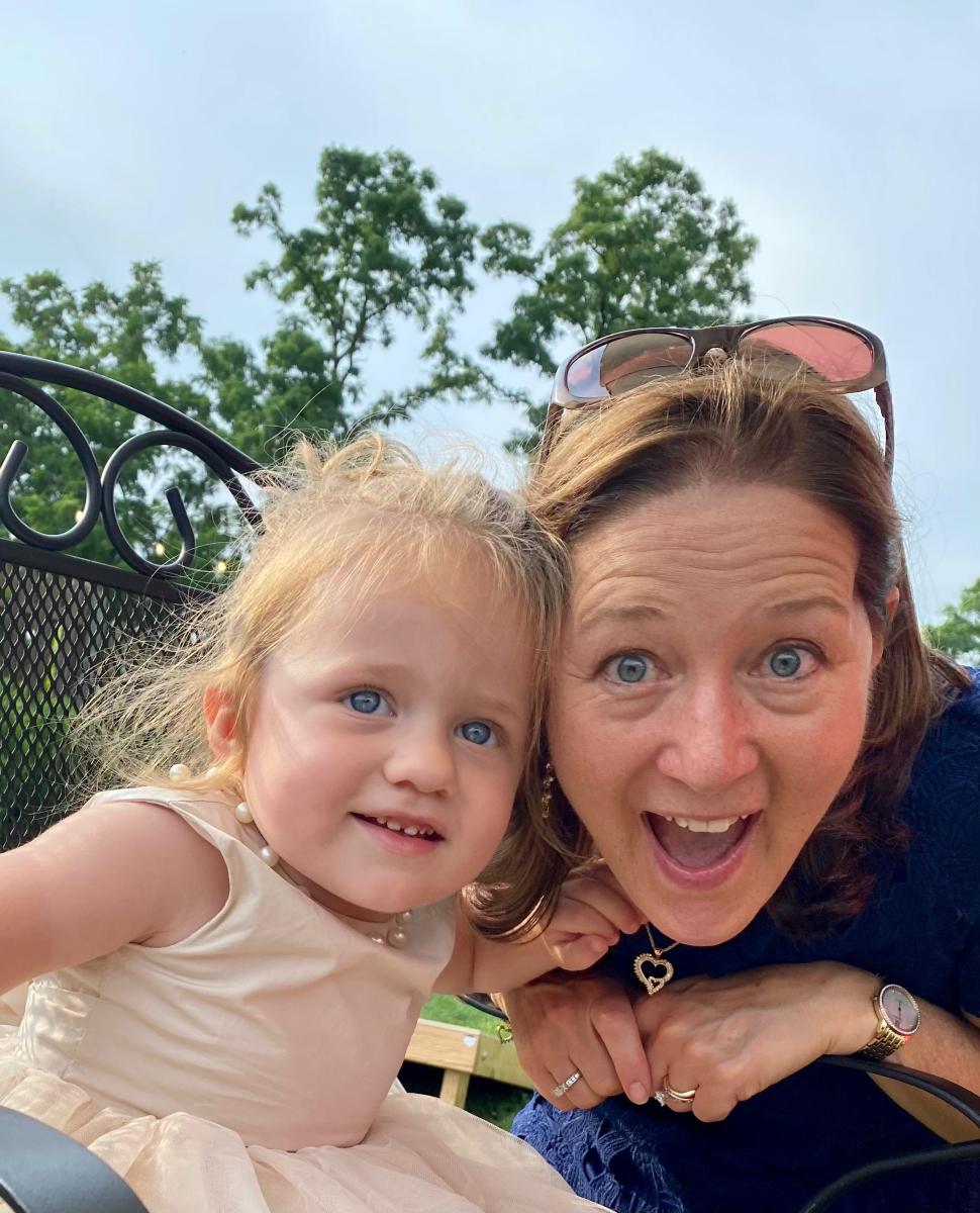 Maria with her granddaughter.