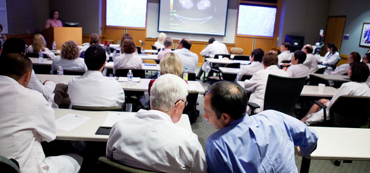 Thoracic Oncology Chief Hossein Borghaei (right) confers with Paul Engstrom at a meeting to evaluate tumors of Fox Chase patients.