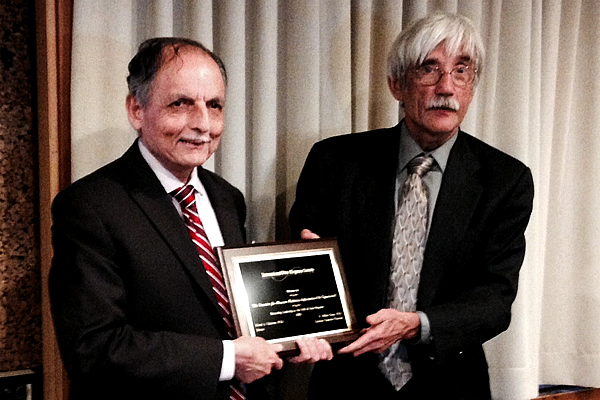 2016 Award to SARI accepted by Mohan Doss (left) from Ed Calabrese, April 19, 2016