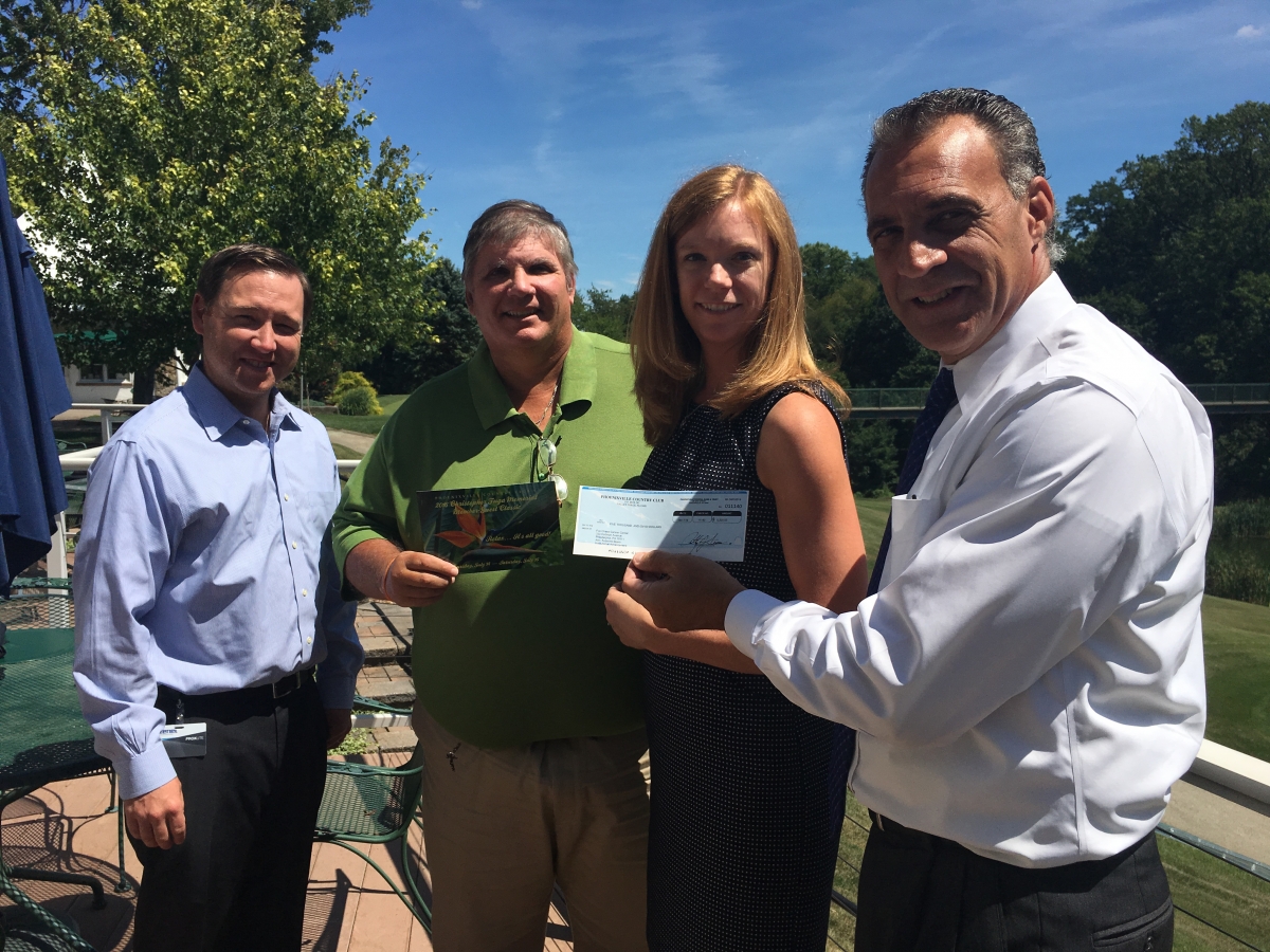A $5,000 check from 2015's Fuga Memorial Tournament at Phoenixville Country Club.   L-R Mike English (cousin of Christopher Fuga), Mark Fuga (father of Christopher Fuga), Suzanne Beers and Tony Lucas, General Manager of Phoenixville Country Club.