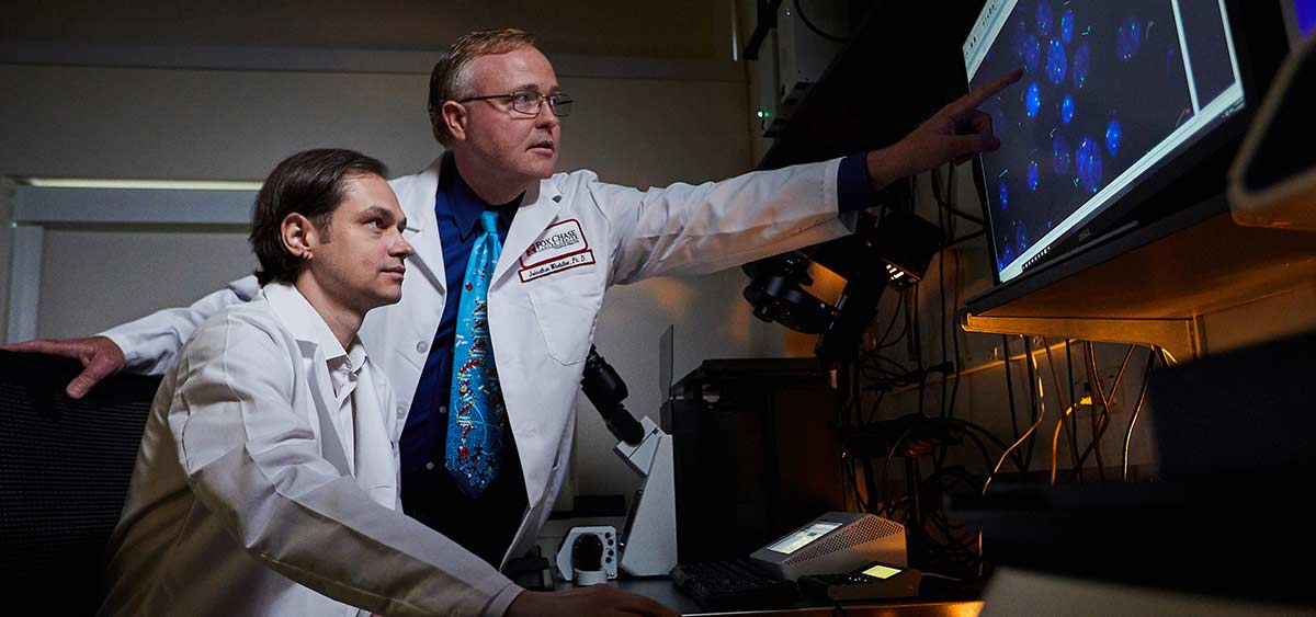 Dr. Johnathan Whetstine and Dmitry Levchenko, MD (seated). The award will allow Whetstine’s lab to follow up on previous work investigating epigenetic factors that control copy number gains, which contribute to heterogeneity within lung tumors. The main goal of the new research is to build a network of the regulatory input signals that are influencing heterogeneity through copy number mechanisms.