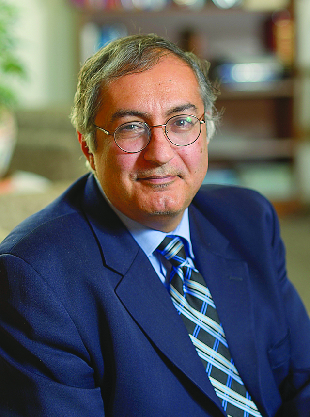 A portrait shot of Wafik S. El-Deiry smiling at the camera.