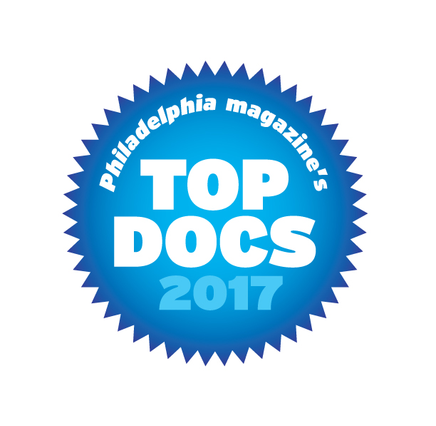 A spiky blue circle with "Philadelpha Magazine's Top Docs 2017" written inside in white.