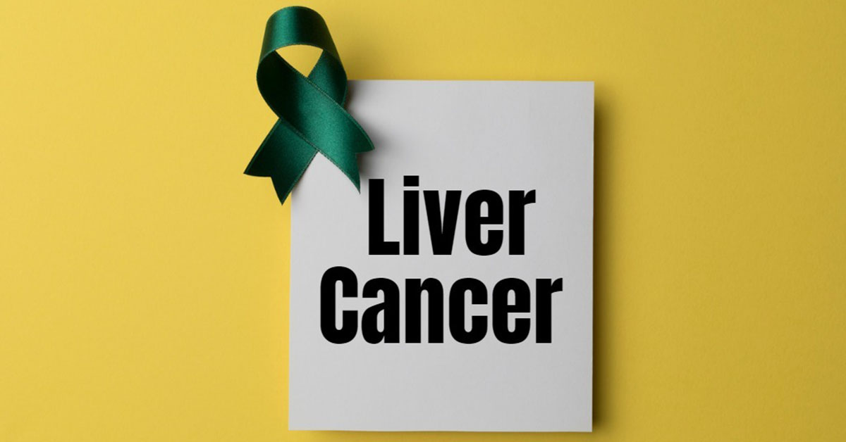 A paper reading "Liver Cancer" in bold black lettering with a green ribbon atop the corner, set on a yellow background.