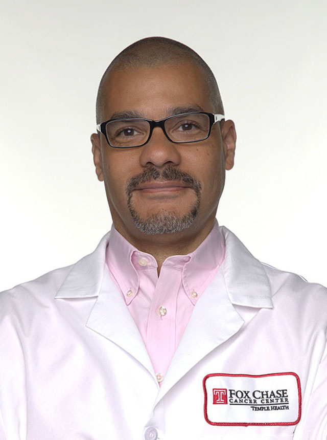 Paul Campbell, a physician at Fox Chase Cancer wearing a white coat