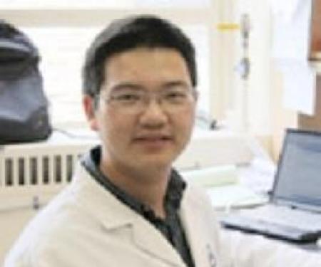 A portrait shot of Yong Zhang smiling at the camera.