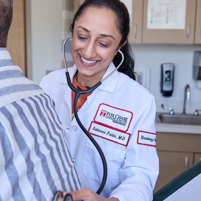 Dr. Sukhmani Padda examining a patient.