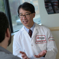 Dr. Chen with a patient