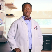 Portrait of Dr. Robert A. Winn in research laboratory